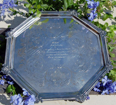 Silver tray with writing.