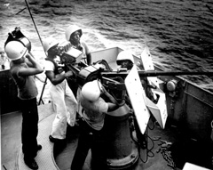 Men working the ship's gun