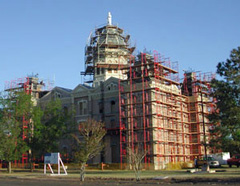 Scaffolding covers much of the courthouse during construction.