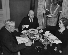 Historic image of Rayburns at the breakfast table.