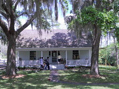 Visitors entering a cottage on the grounds.