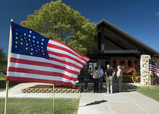 US flag waves near entrance to Fort Lancaster.