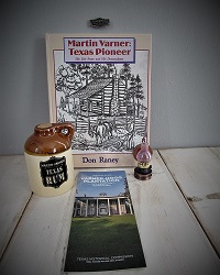 Martin Varner Texas Pioneer book, rum jug (empty), pencil sharpener, site guide