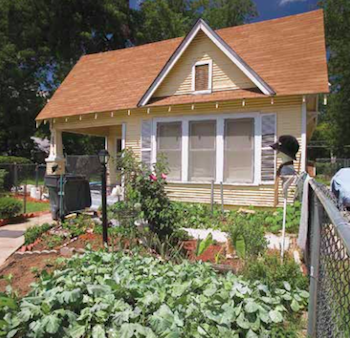 Bungalow home with a thriving garden in the front yard