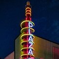 A night photo of the neon marquee of the Plaza Theater in Garland Texas