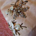 Detail of beading on the gown that belonged to Medibel (Rayburn) Bartley.