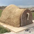 A preheated adobe oven ready for baking.