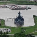 Wide shot photo of the Battleship Texas docked at San Jacinto Battleground State Historic Site