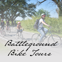 people biking on a road. Text reads: Battleground Bike Tour