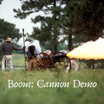 men firing a cannon; text says Boom Cannon Demo