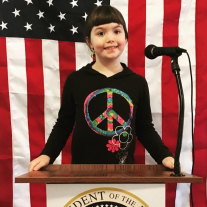 A girl poses at our Presidential Podium.