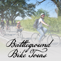 Three people biking under trees. Text reads: Battleground Bike Tours