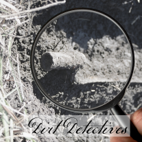 picture of a bayonet handle coming out of the ground, with a magnifying glass focused on it. Text reads: Dirt Detectives