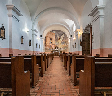 The interior of a chapel, facing the altar