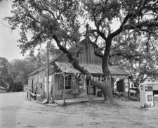 A black and white photo of a historic general store building